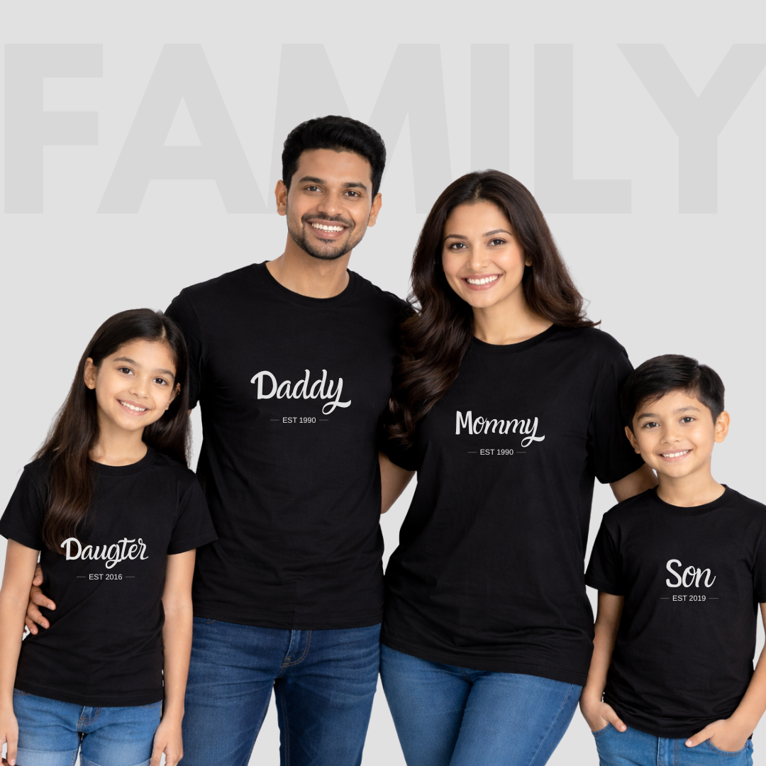Family of four wearing matching black t-shirts with family roles on a light gray background.